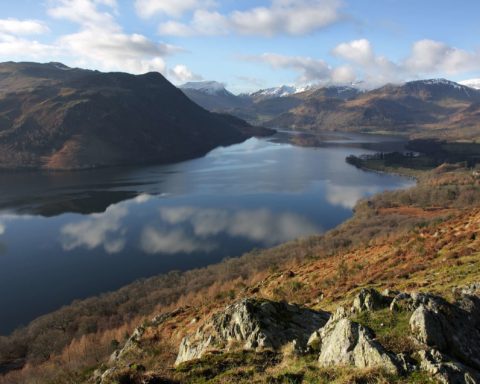 Ullswater and the snow-topped Helvellyn range in the Lake District National Park - Lake District Holidays