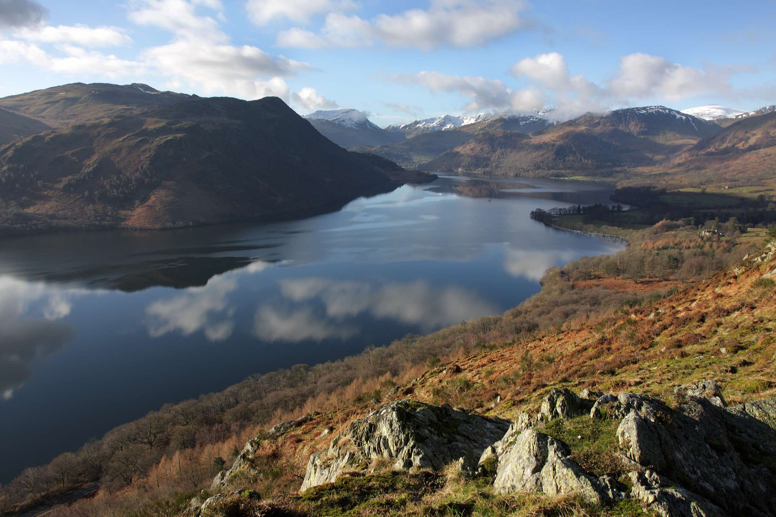 Ullswater and the snow-topped Helvellyn range in the Lake District National Park - Lake District Holidays
