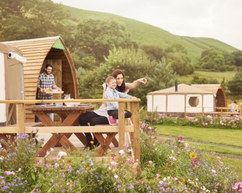 Young family enjoying glamping in Cumbria
