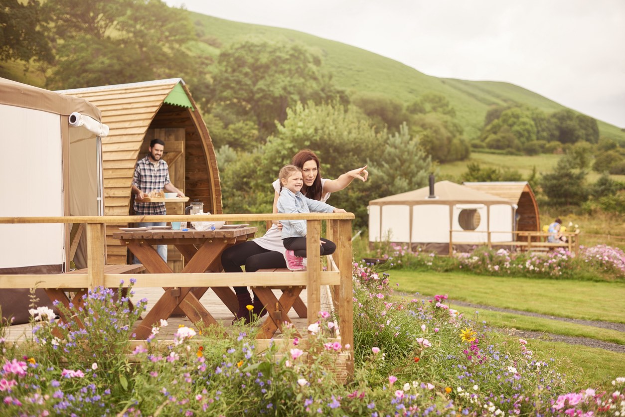 Young family enjoying glamping in Cumbria