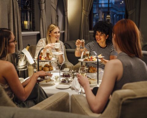 Four people enjoying afternoon tea in the lake district