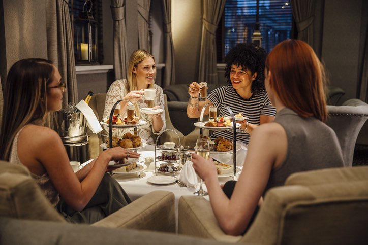 Four people enjoying afternoon tea in the lake district