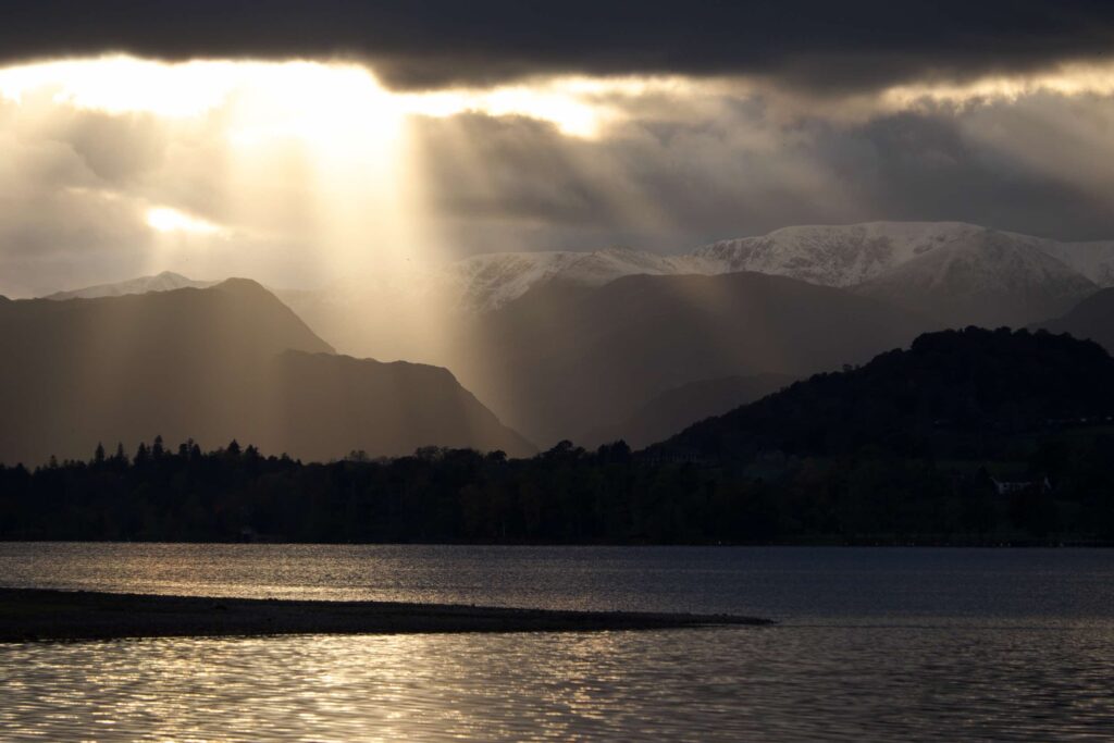 Looking along Ullswater to the snow-covered Helvellyn range in the distance