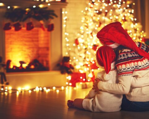 lake district christmas breaks - mother and daughter looking at fire