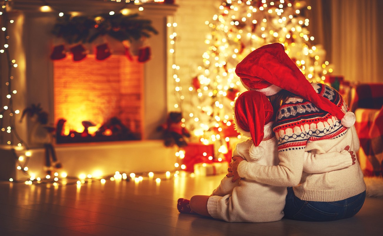 lake district christmas breaks - mother and daughter looking at fire