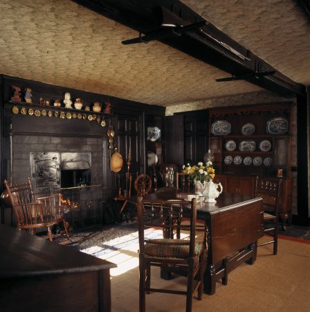 Overview of part of Entrance Hall at Hill Top showing the kitchen range, Georgian dresser, 'rag' rug and Chippendale type chairs often used to illustrate Potter's books.
