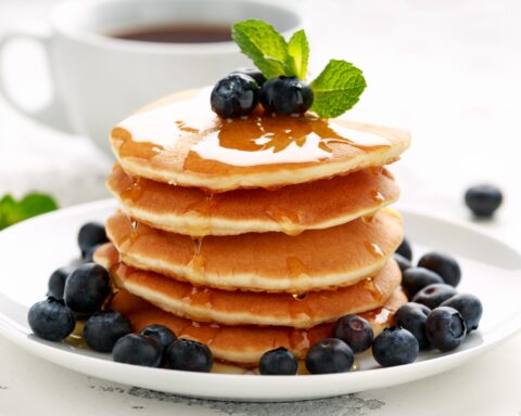 Pancake stack with blueberries and maple syrup - cafes in lake district that do brunch