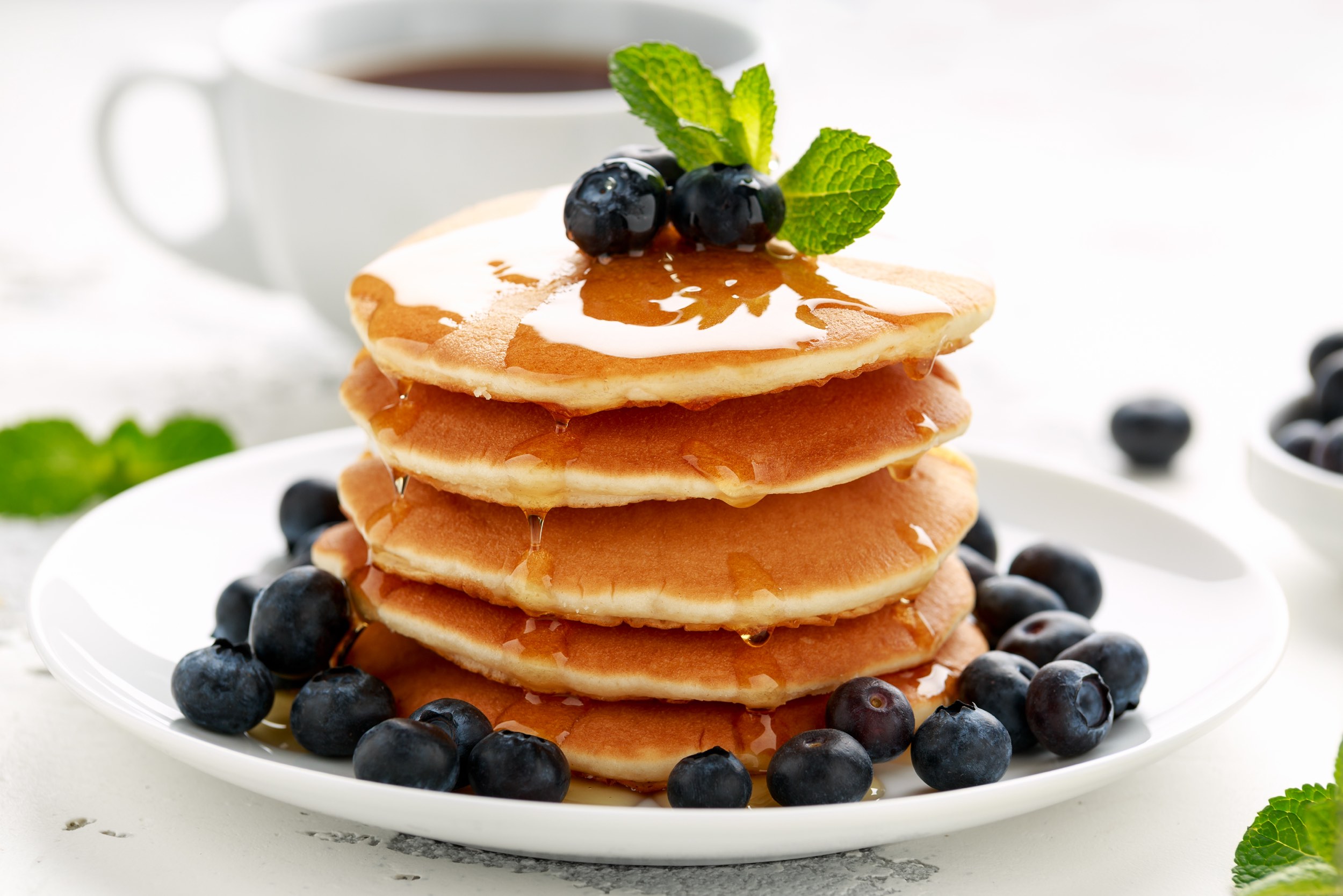 Pancake stack with blueberries and maple syrup - cafes in lake district that do brunch